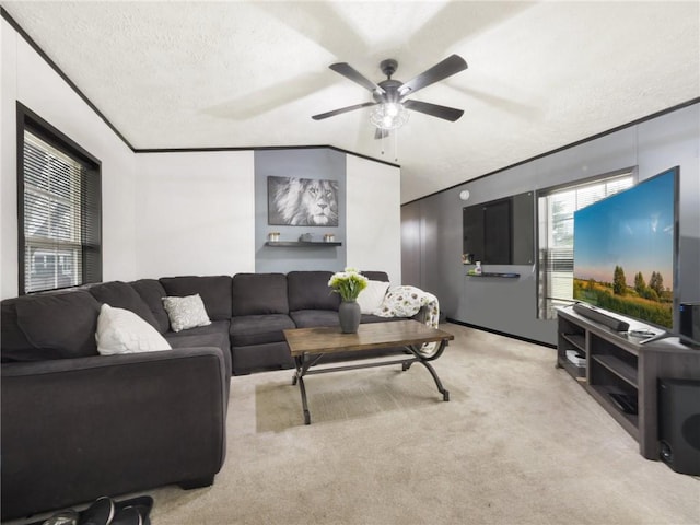 living room featuring light carpet, a textured ceiling, vaulted ceiling, and ceiling fan