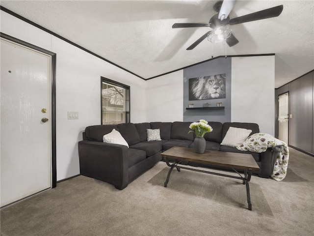 carpeted living room featuring a textured ceiling, crown molding, ceiling fan, and lofted ceiling