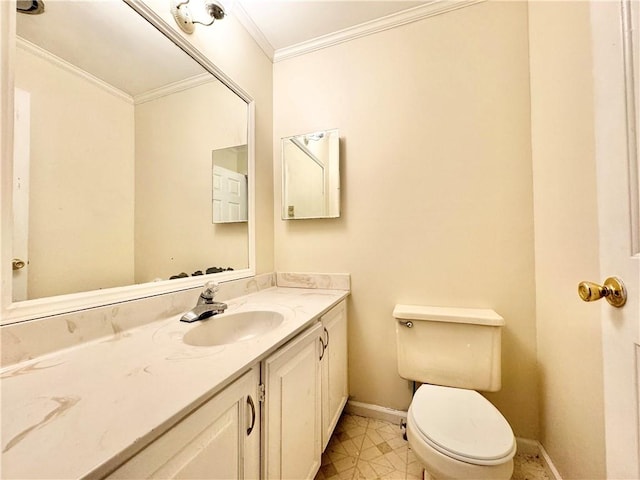 bathroom featuring toilet, vanity, and ornamental molding