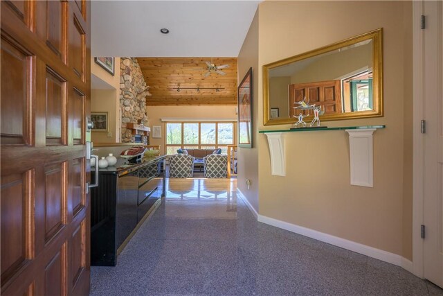 hallway featuring high vaulted ceiling