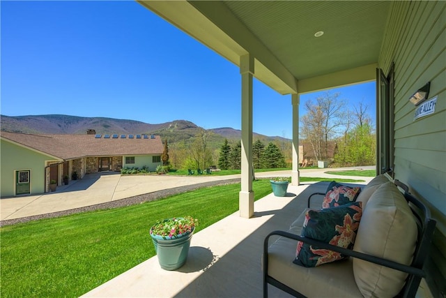 view of patio / terrace featuring a mountain view