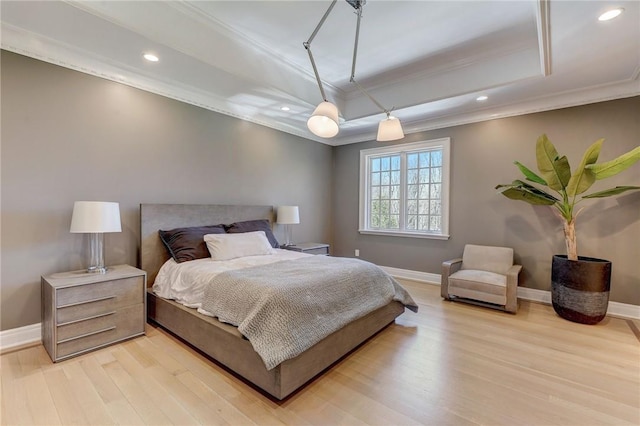 bedroom featuring light hardwood / wood-style flooring, ceiling fan, and ornamental molding