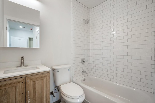 full bathroom with vanity, toilet, and tiled shower / bath