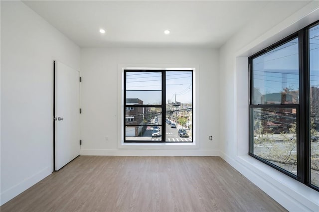 unfurnished room featuring light wood-type flooring