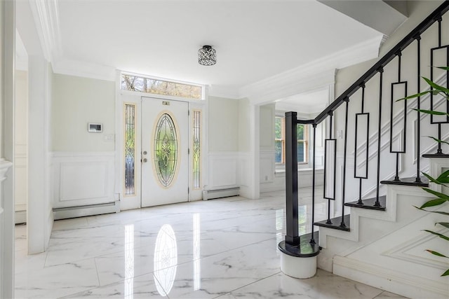 foyer entrance featuring crown molding and baseboard heating