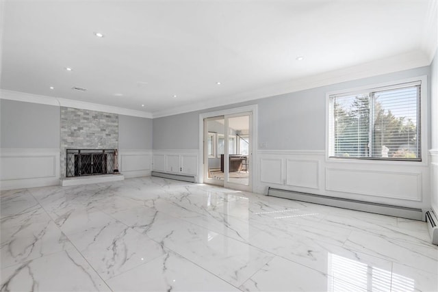 unfurnished living room with a fireplace, baseboard heating, and crown molding