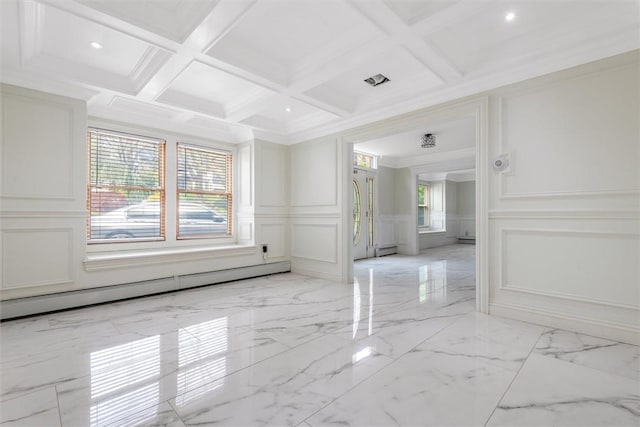 spare room with beam ceiling, a baseboard radiator, ornamental molding, and coffered ceiling