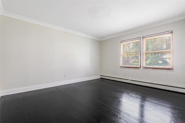 spare room with dark hardwood / wood-style flooring, baseboard heating, and crown molding