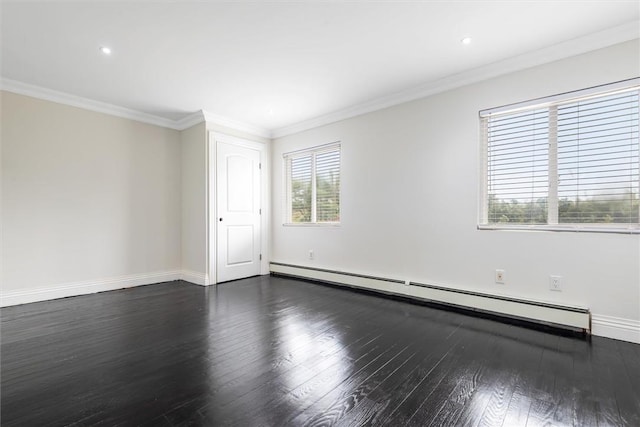 spare room featuring crown molding, baseboard heating, and dark wood-type flooring