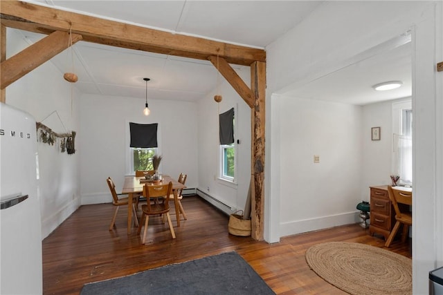 dining space featuring a baseboard radiator and dark wood-type flooring