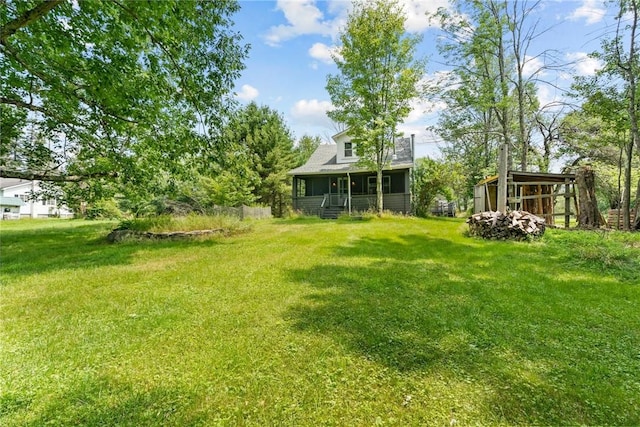 view of yard with covered porch