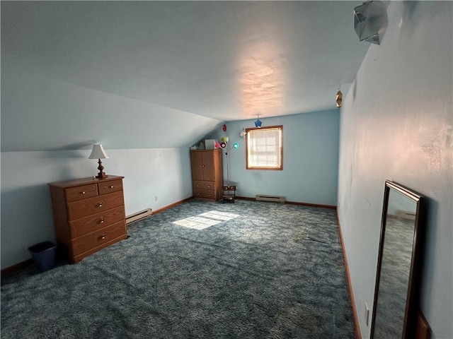 additional living space featuring dark carpet, baseboard heating, and lofted ceiling