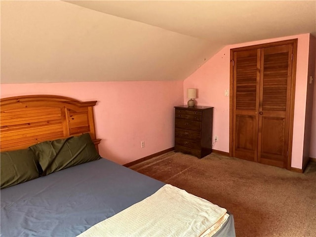 carpeted bedroom with vaulted ceiling