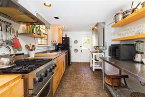 kitchen with sink, stainless steel appliances, and ventilation hood