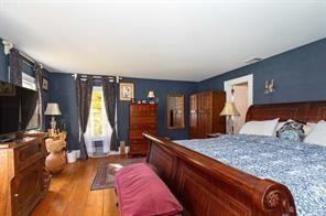 bedroom featuring dark hardwood / wood-style flooring