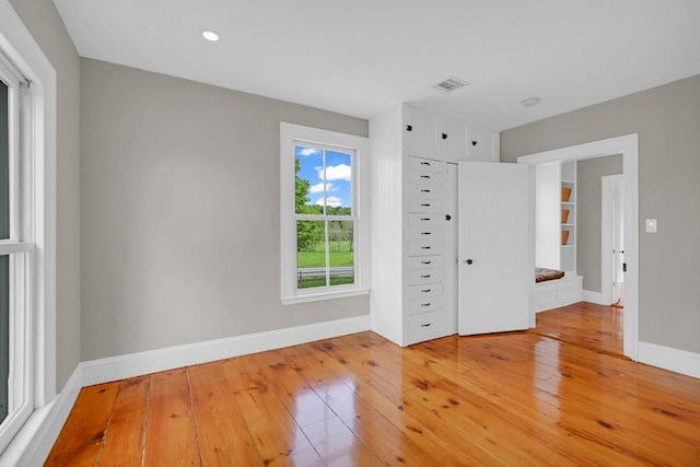 unfurnished room featuring hardwood / wood-style floors