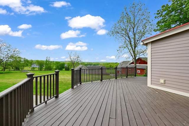 wooden deck with a lawn