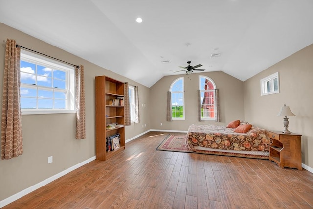 unfurnished bedroom featuring ceiling fan, hardwood / wood-style floors, and lofted ceiling