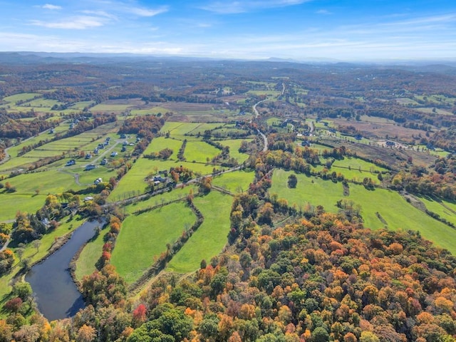 aerial view with a rural view and a water view