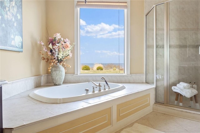 bathroom featuring shower with separate bathtub