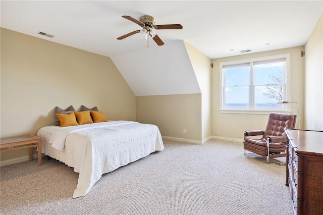 bedroom featuring ceiling fan, lofted ceiling, and light carpet