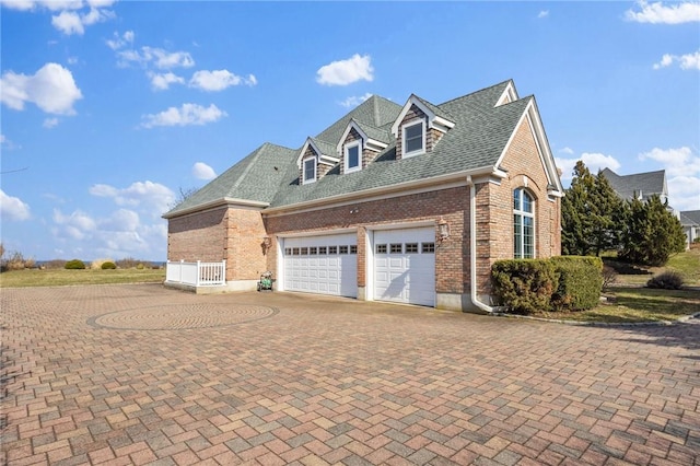 view of side of home featuring a garage