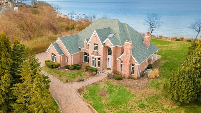 view of front of home with a water view and a front yard