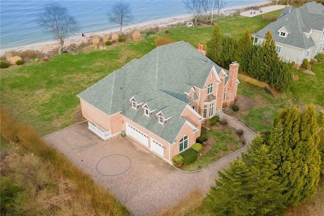 bird's eye view featuring a view of the beach and a water view