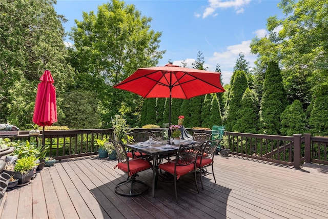 wooden deck featuring outdoor dining area