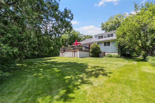 view of yard featuring a wooden deck