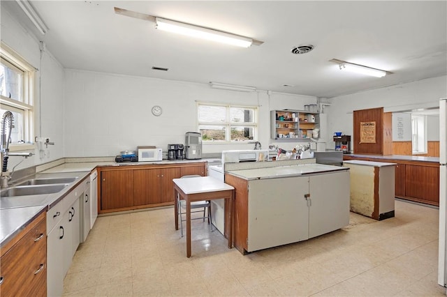 kitchen featuring a center island and sink