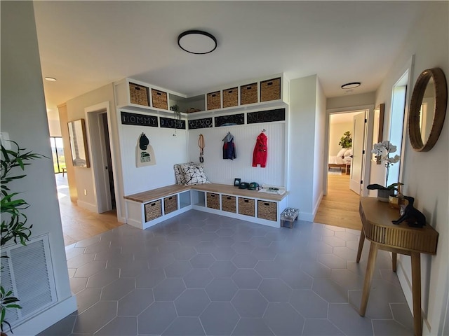 mudroom featuring dark wood-type flooring