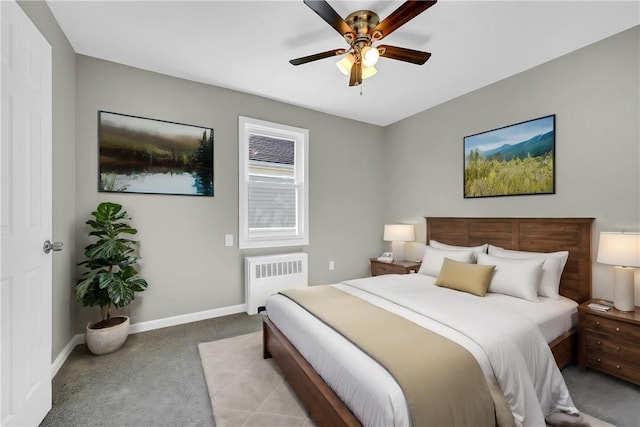 bedroom featuring radiator, ceiling fan, and light carpet