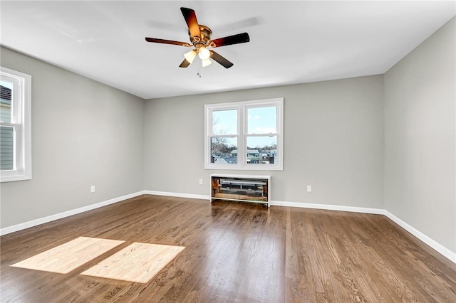 unfurnished living room with hardwood / wood-style flooring and ceiling fan