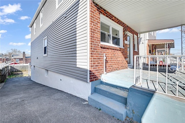 view of property exterior with covered porch