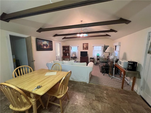 dining area featuring beam ceiling and ceiling fan