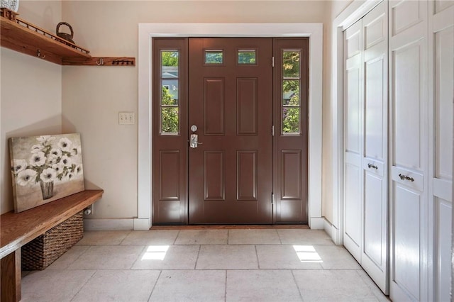 tiled foyer featuring a wealth of natural light