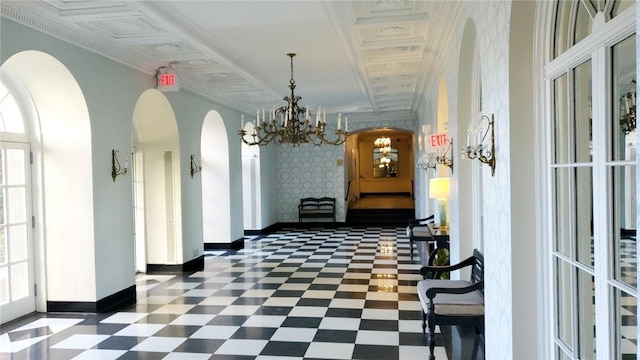 hallway featuring a notable chandelier, crown molding, a wealth of natural light, and french doors