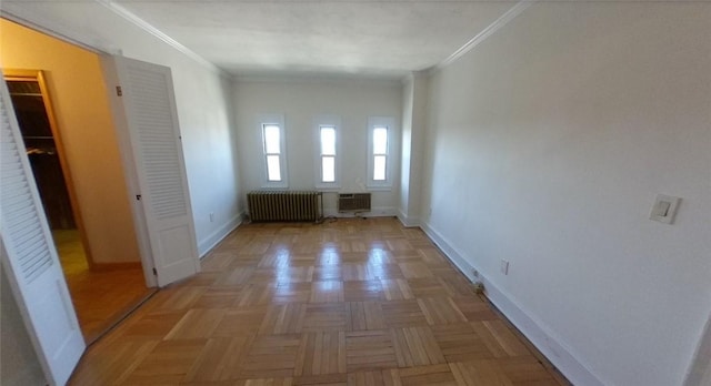 interior space featuring radiator heating unit, light parquet floors, and crown molding