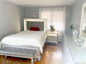 bedroom featuring wood-type flooring