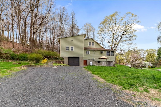 view of front of house featuring a front yard and a garage