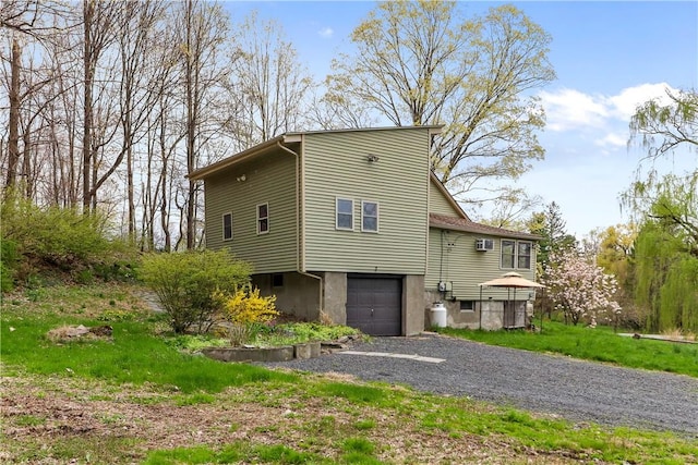 view of side of home featuring a garage