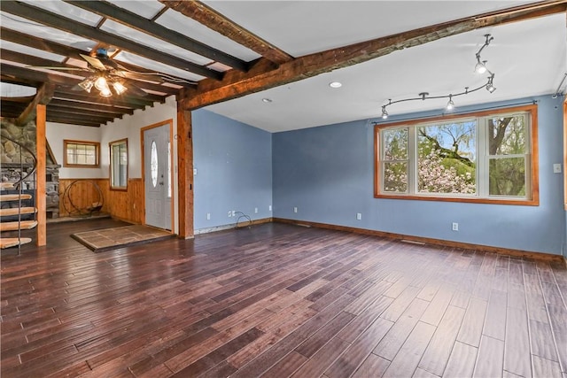 interior space with ceiling fan, beam ceiling, and dark wood-type flooring