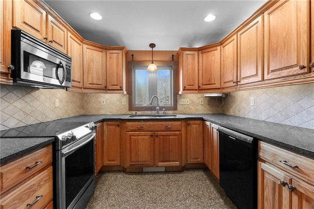 kitchen featuring pendant lighting, backsplash, sink, and appliances with stainless steel finishes