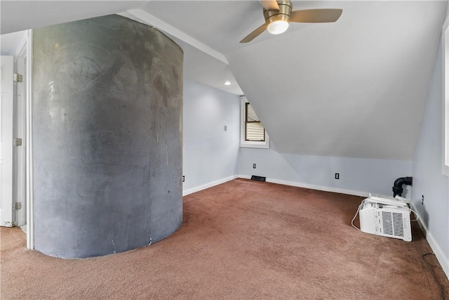 additional living space with carpet, vaulted ceiling, and ceiling fan