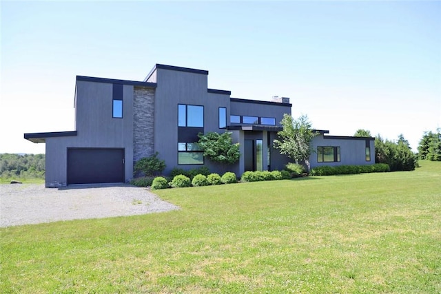 modern home with a front yard and a garage