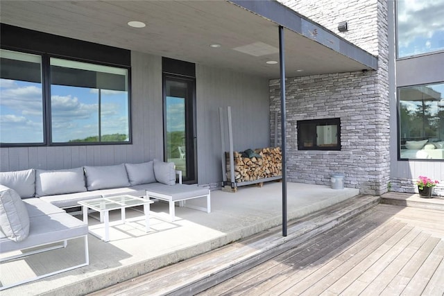 wooden deck featuring an outdoor hangout area