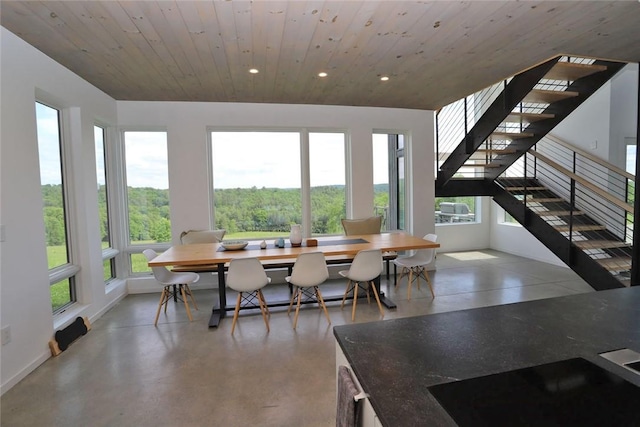 dining room with wooden ceiling