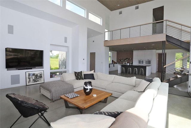 living room with a towering ceiling