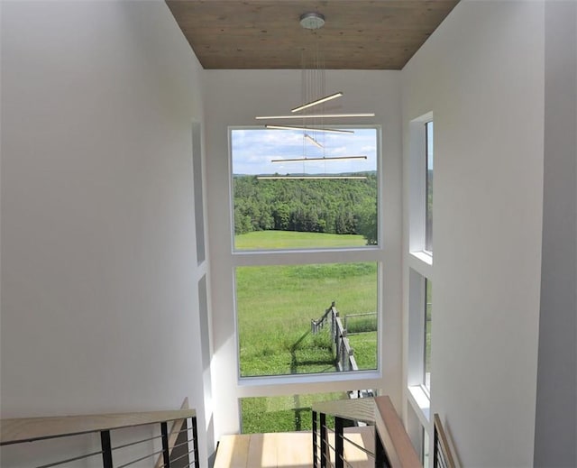 interior space featuring a healthy amount of sunlight and wooden ceiling